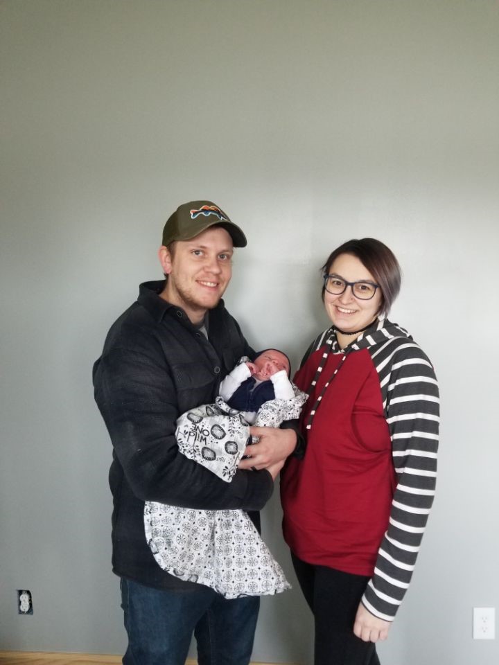 Blake, his wife Aryn, and their new son Cain Scoville