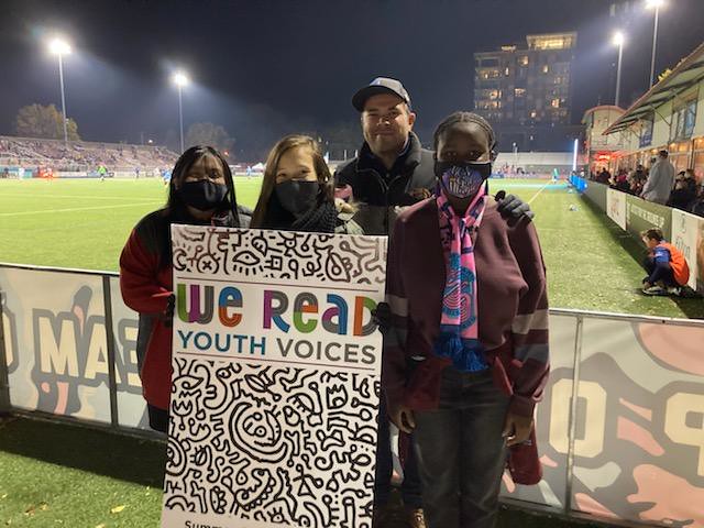 We Read Youth Voices Writing Contest participants at a Forward Madison FC game