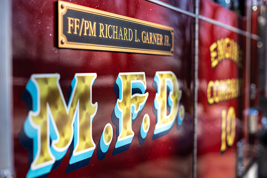 Plaque honoring Firefighter/Paramedic Richard Garner on Engine 10