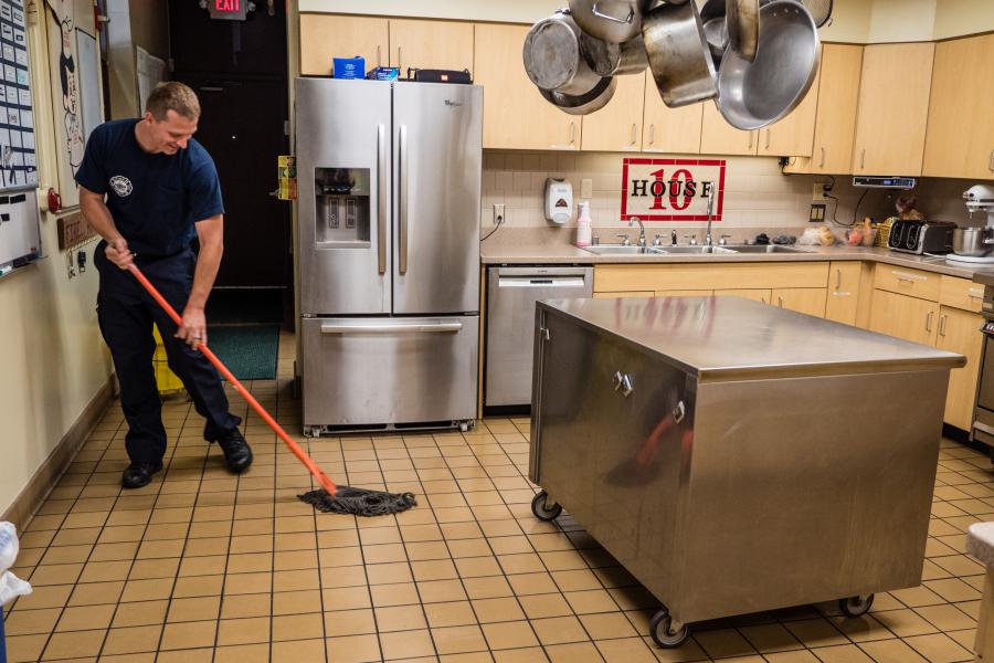 Station 10 Kitchen - Living at the fire station means keeping up on all the chores, including mopping!