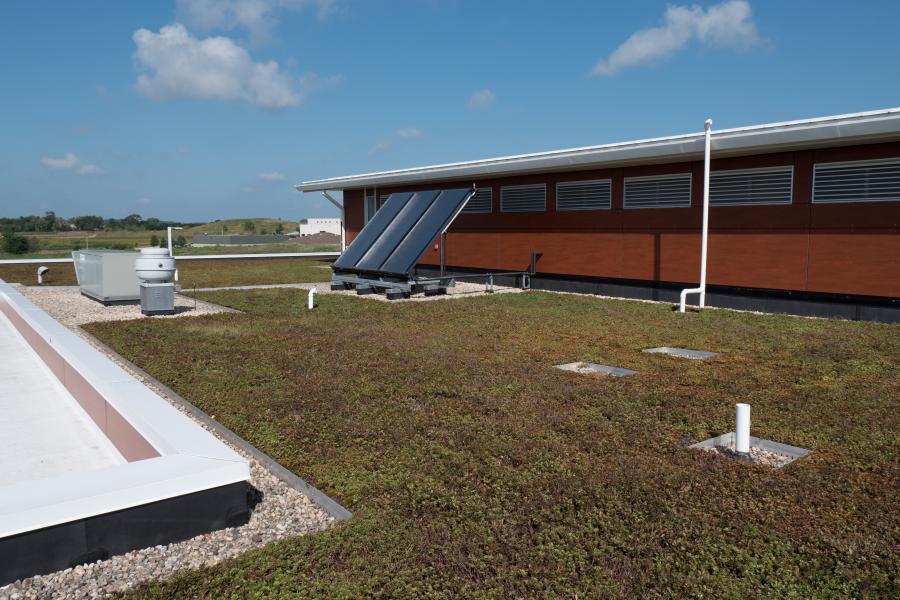 Green Roof & Solar Panels - Sedum planted on the rooftop absorbs rain water and attracts honeybees, and the station's hot water is powered by solar energy.