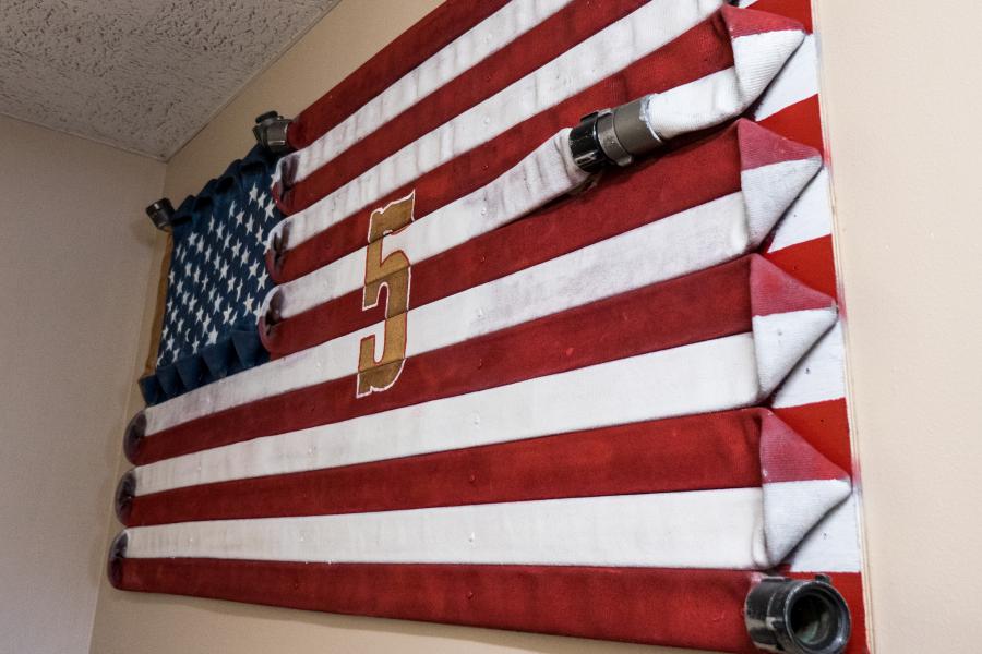 Fire Hose Flag - A custom flag made of painted fire hose was crafted for Station 5 by late firefighter Richard Garner, who began his career at Station 5.