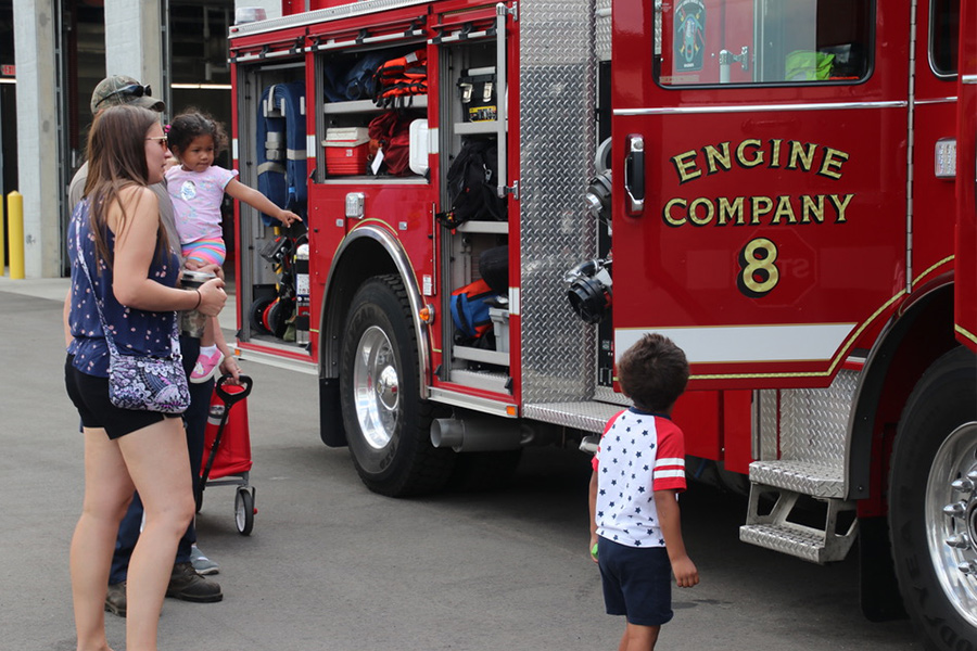 A family looks at the electric Fire Engine 8