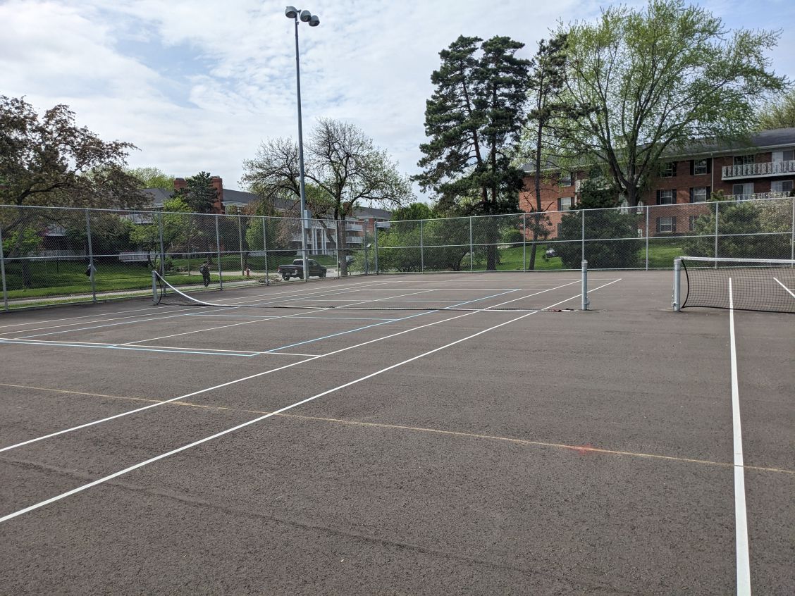 a picture of the west tennis courts with incorrectly installed expansion joints