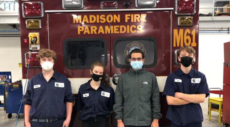 High School Apprentices in front of ambulance