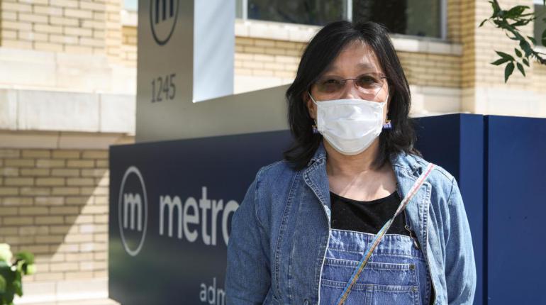 Metro rider wearing a face mask.