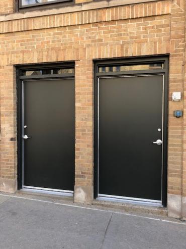 Example of two downtown doors before art is installed on them.