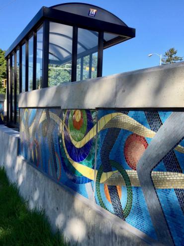 Image of mosaic wall with bus shelter