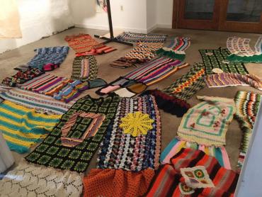 Sections of the poll wraps for the yarn bombing project Women Take the Polls