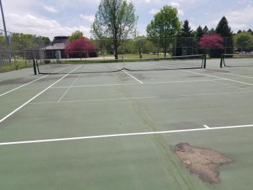worn tennis court at rennebohm park