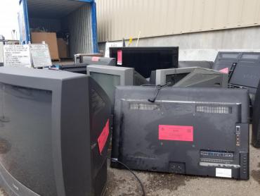 Televisions at the drop-off site ready for recycling