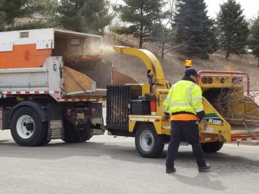 Wood chipper chipping wood. Collection begins April 6. Expect delays.