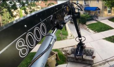 View from the crows nest of a truck mounted crane while collecting a couch