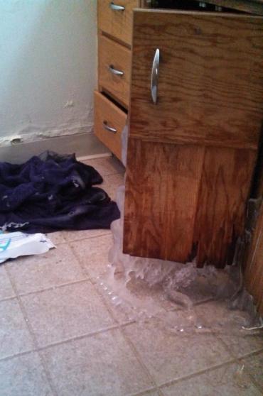 Burst frozen pipe under bathroom sink