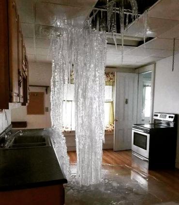 Burst pipe over kitchen in vacant home