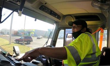Streets Division operator driving a collection truck