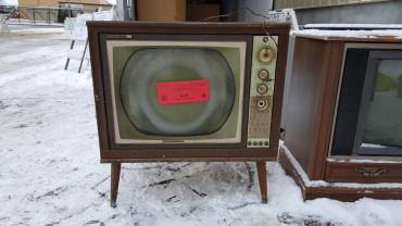 Very old television ready to be recycled at 1501 W. Badger Rd with $15 recycling sticker.