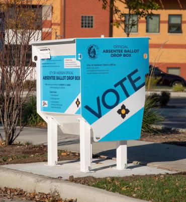 Image of a secure absentee ballot drop box outside City of Madison Fire Station 6 on Perry Street.