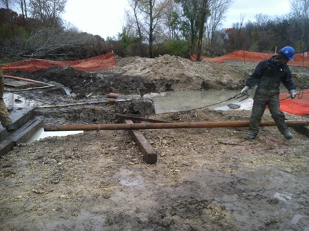 Drilling crews work in wet, muddy conditions