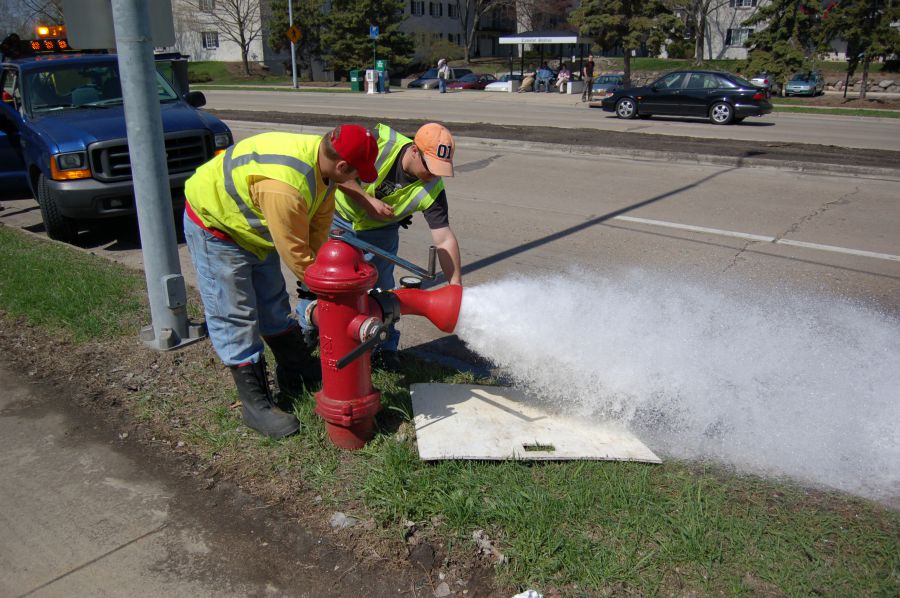 Crew flushing hydrant