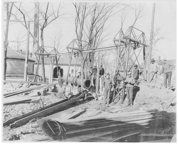 Crew preparing to lay water main pipe in Madison in the late 1800s